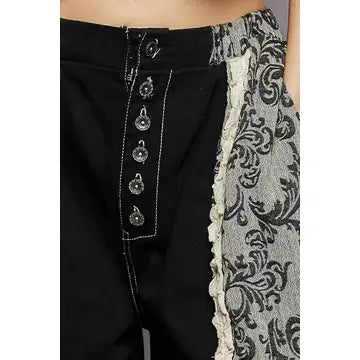 Waist close-up — button-front closure and baroque lace panel detail