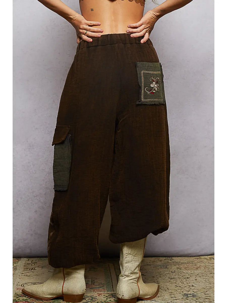 Back view, olive contrast back pocket with embroidery + elastic waistband