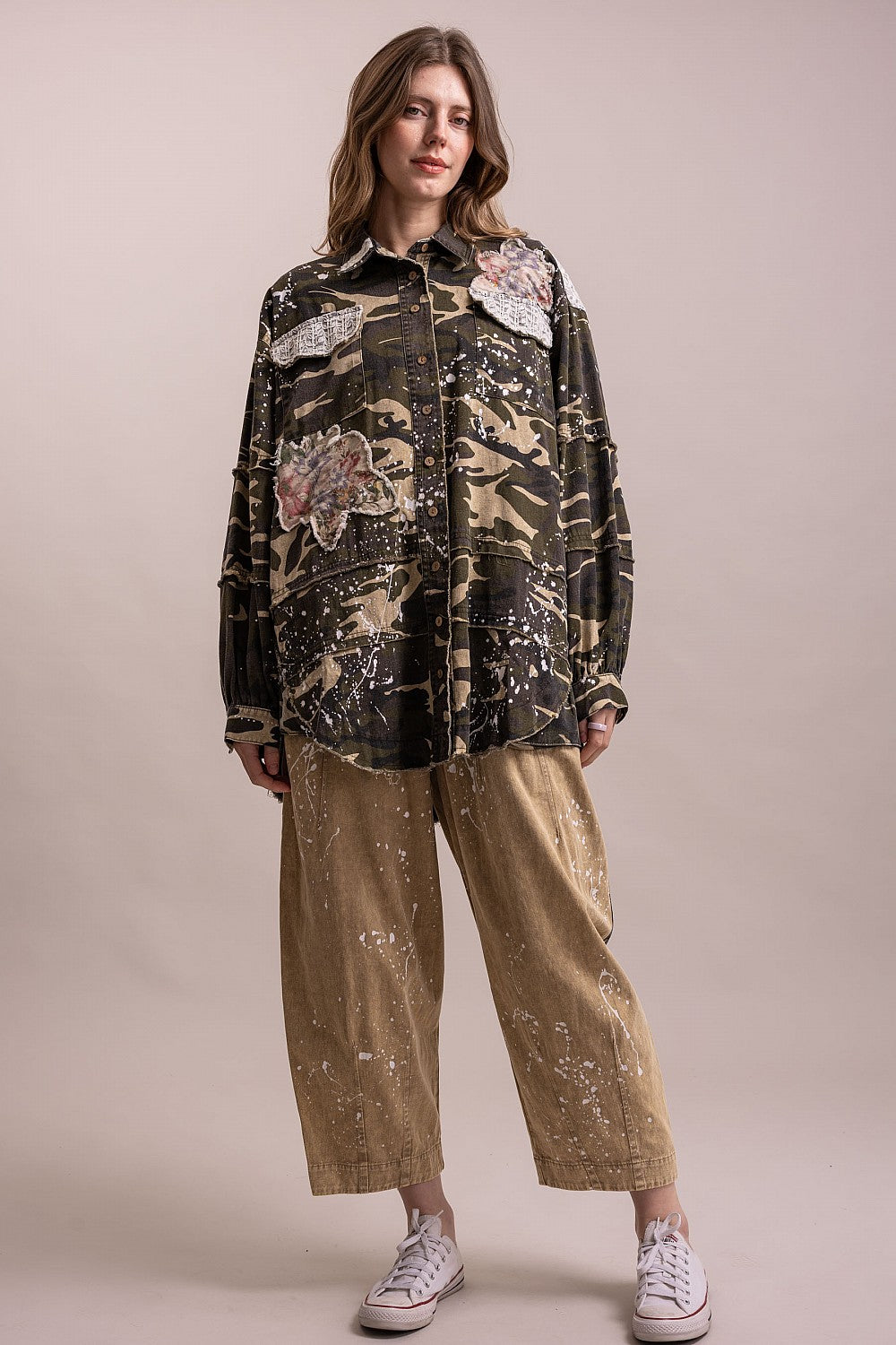 Full-length outfit featuring BlueVelevet camo patchwork jacket with tan cropped wide-leg pants and white sneakers.