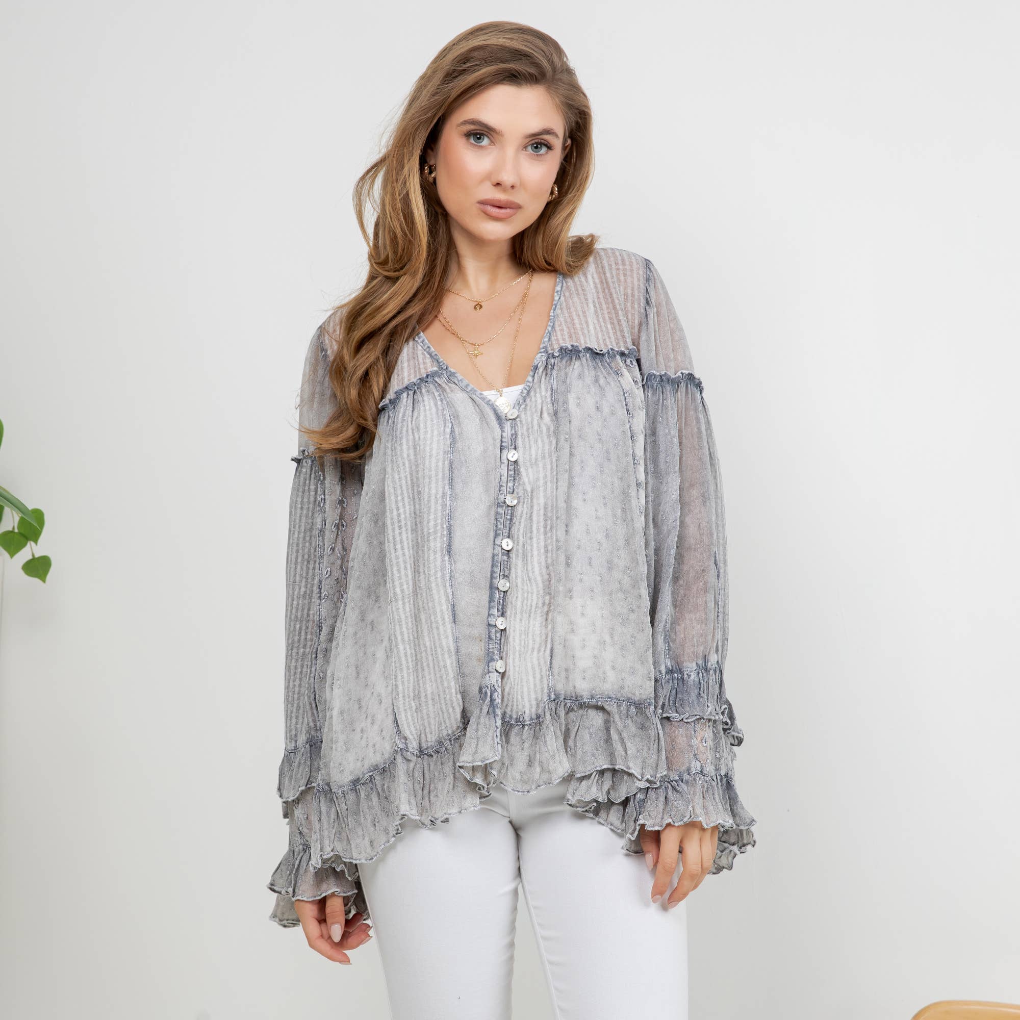 he Reverie Sheer Ruffled Blouse in Grey - front view showing V-neck and button-down closure