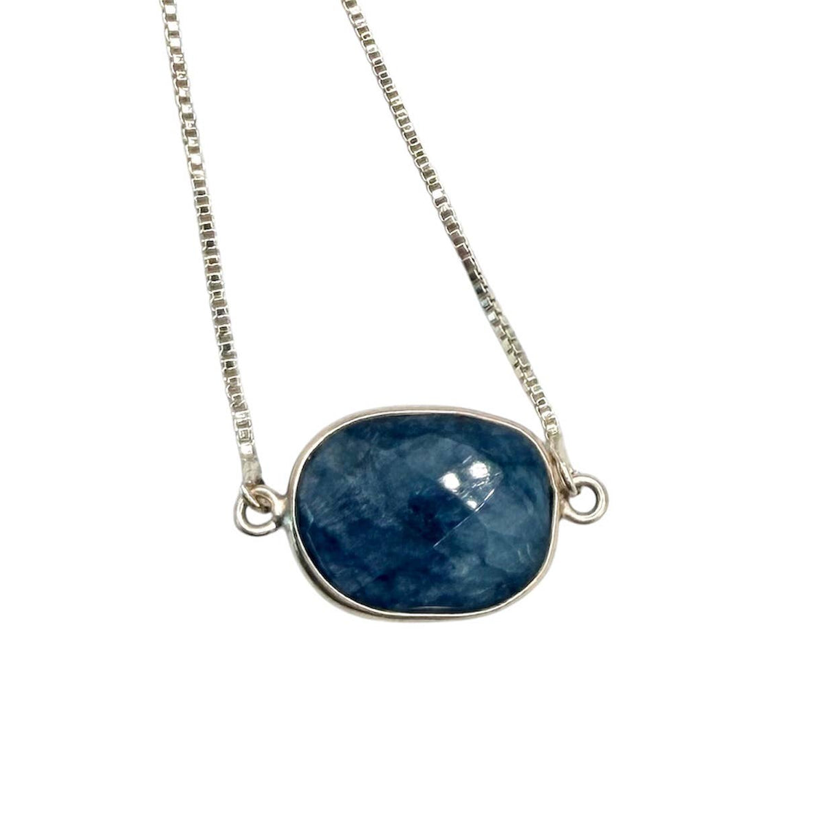 Necklace with a blue stone pendant on a white background