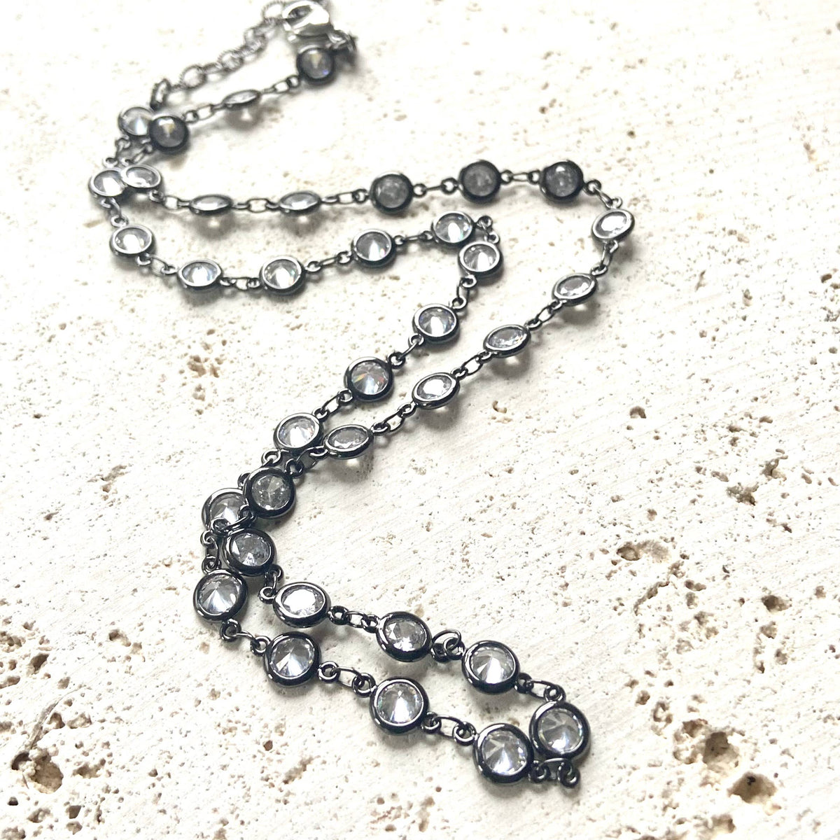 Gunmetal Clear Crystal Layering Boutique Necklace pairs luminous clear crystals with a gunmetal finish
