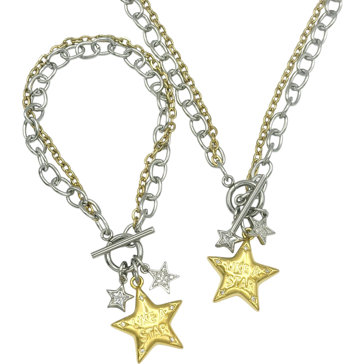 Necklace: & Bracelet close up:  Mixed-metal necklace with silver- and gold-tone chains, a toggle clasp, two small silver stars, and a gold star engraved “Like a Star.”

