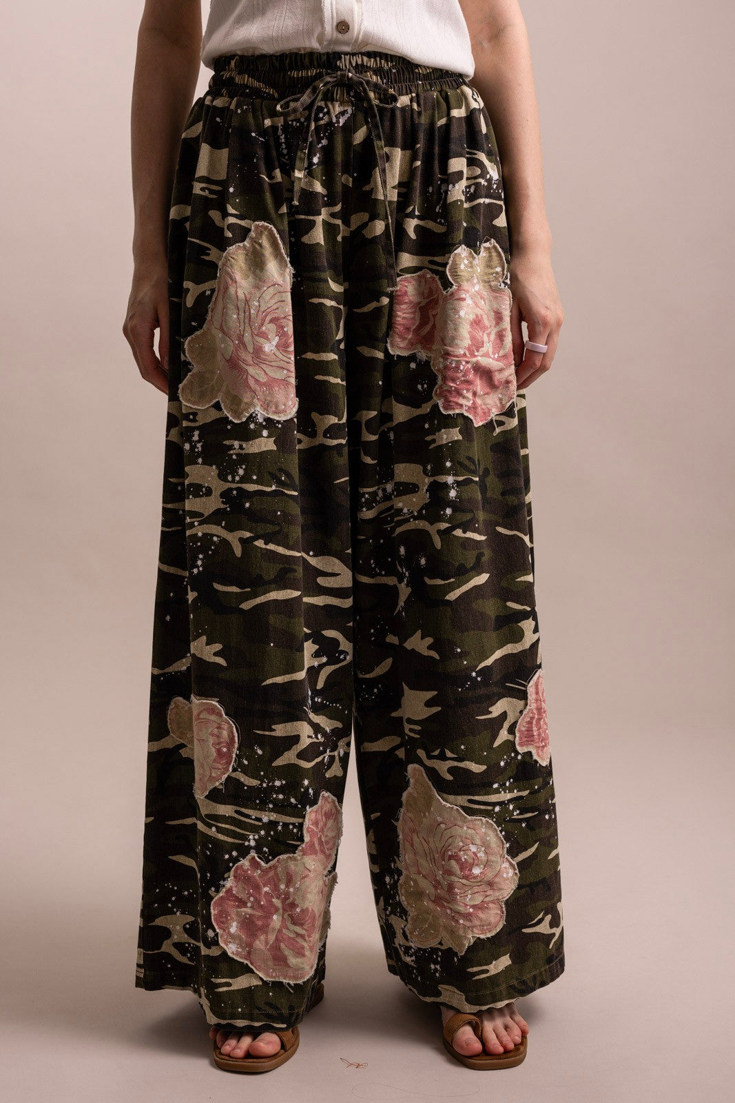 Front view, elastic waistband, pink floral appliqué, relaxed fit