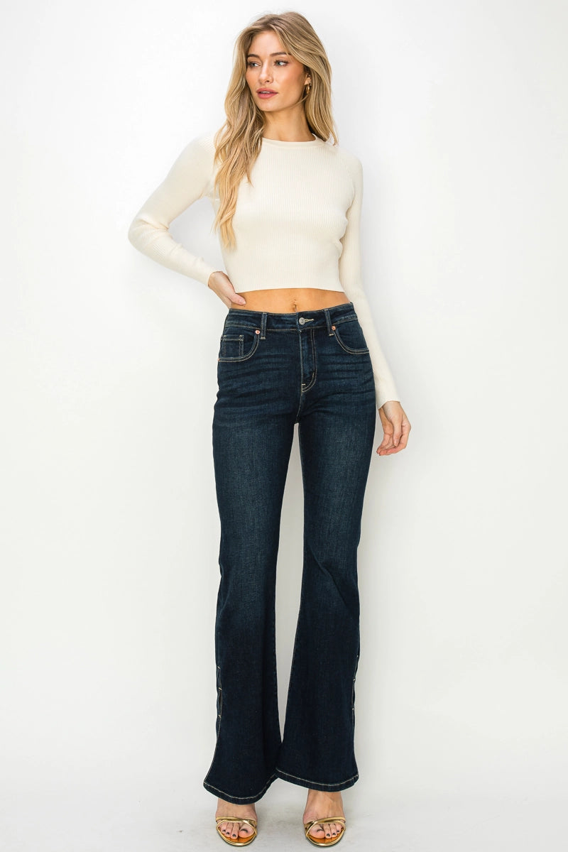 Artemis Vintage Shadow Canyon Flare jeans, high-rise dark-wash denim with flared leg and ankle zip slit, front view at a distance.