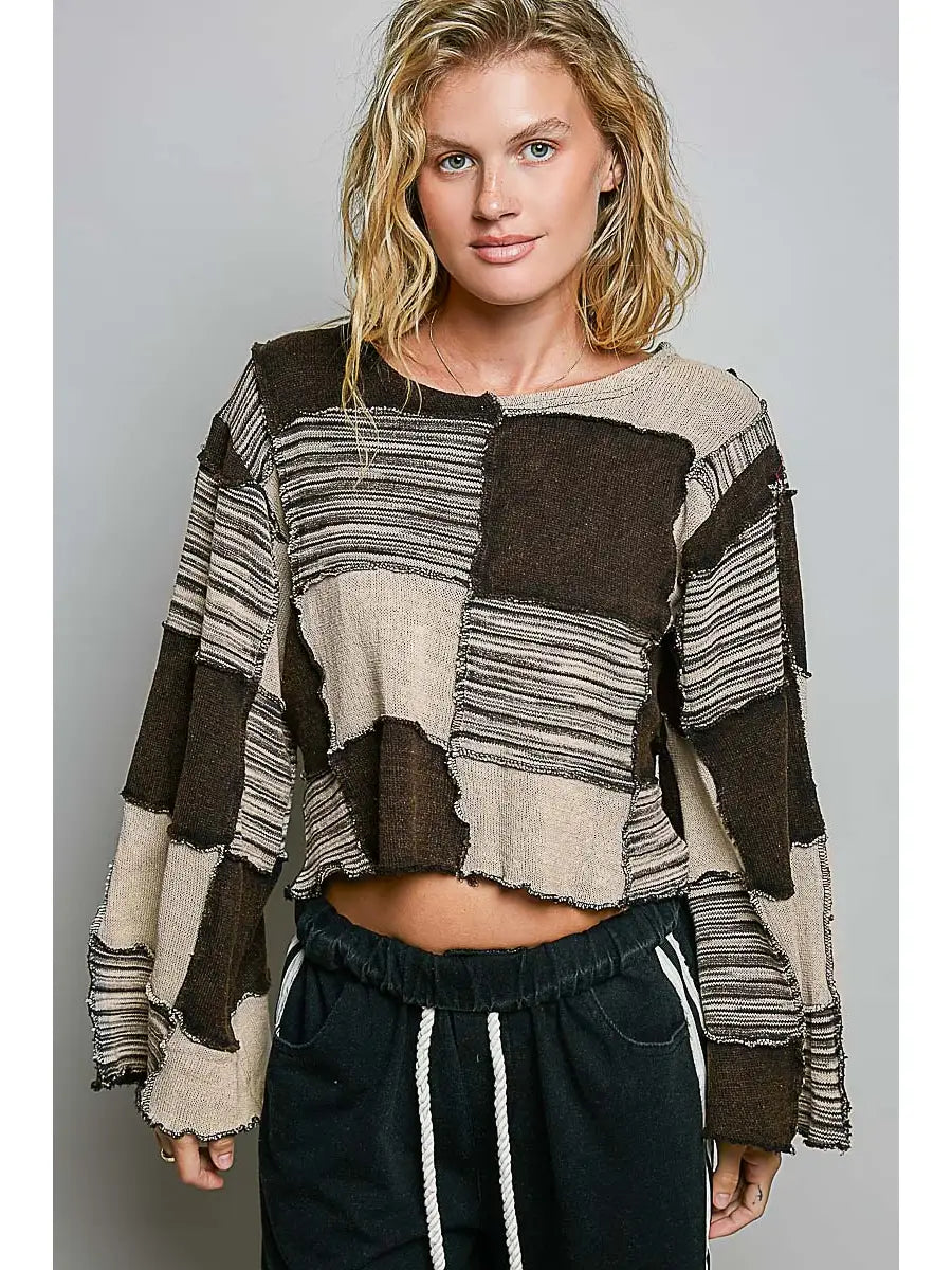 Darling Patchwork Cropped Long-Sleeve top in black and tan colorblock with exposed overlock seams 