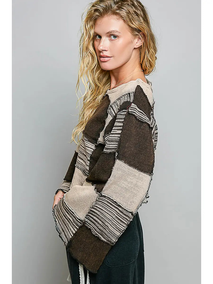 Darling Patchwork Cropped Long-Sleeve top showing mixed stripe and solid patchwork panels with raw seam detail 
