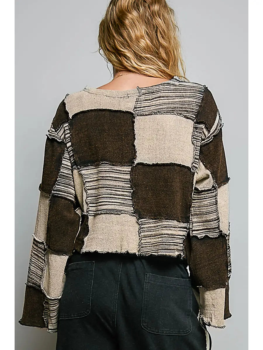 Back view of Darling Patchwork Cropped Long-Sleeve top highlighting artisan patchwork construction and exposed overlock seams 
