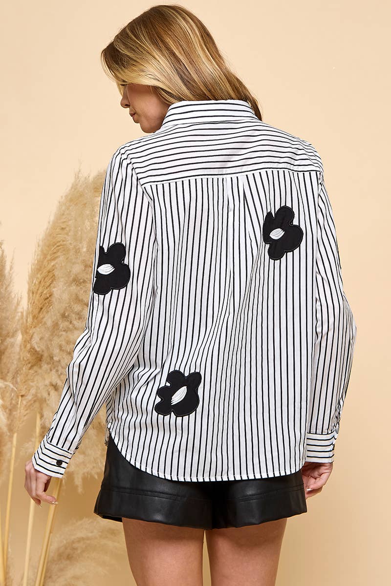 Vertical stripe collared blouse featuring black daisy accents