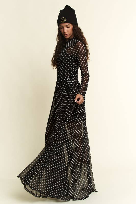 Black polka-dot mesh long-sleeve maxi dress with high neck and flowy, sheer overlay.