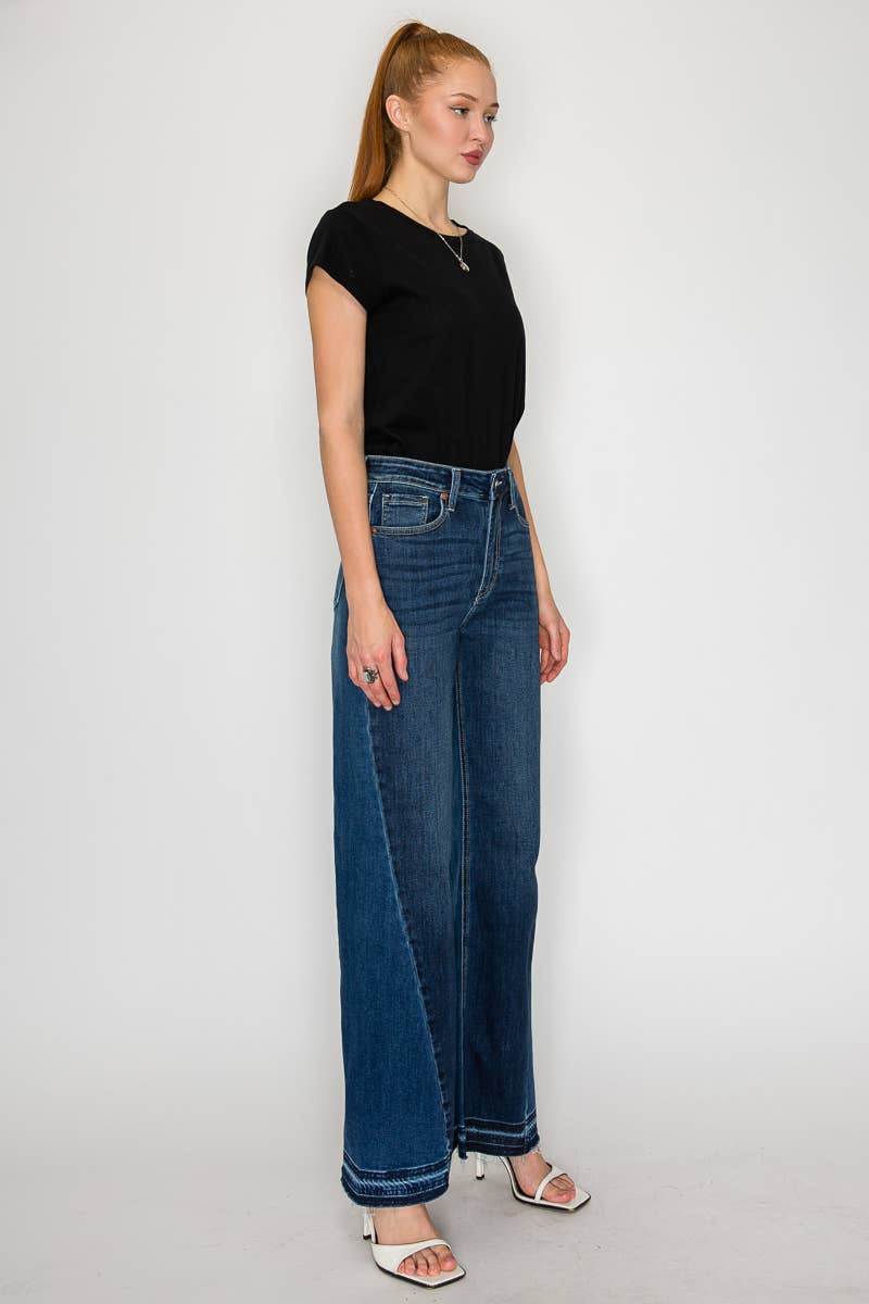Flare jeans hem detail - unique polished hem treatment on dramatic long flare silhouette

