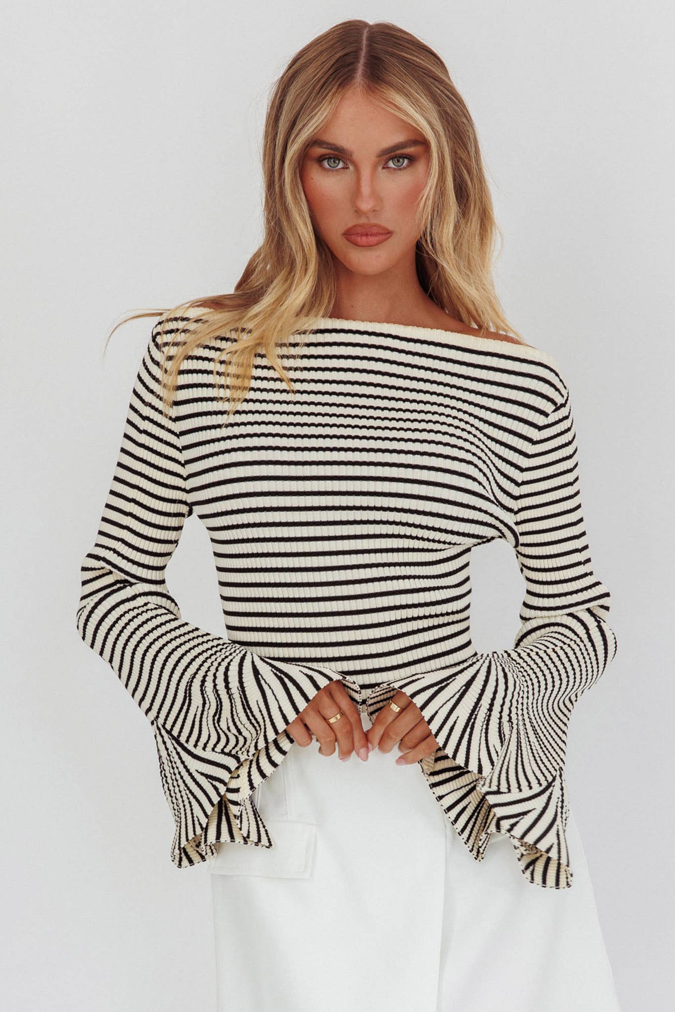 Black-and-ivory horizontal stripe sweater, ribbed, long sleeves with flare