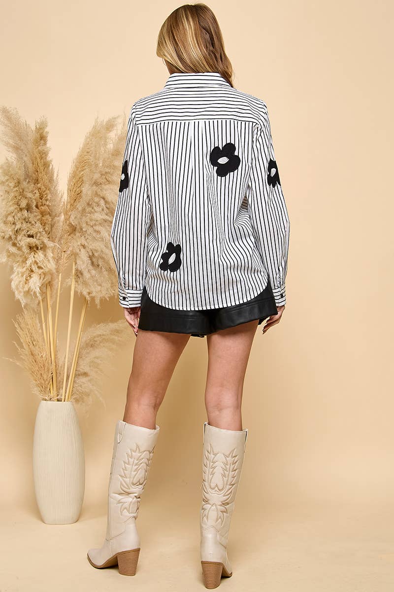 Vertical stripe collared blouse featuring black daisy accents