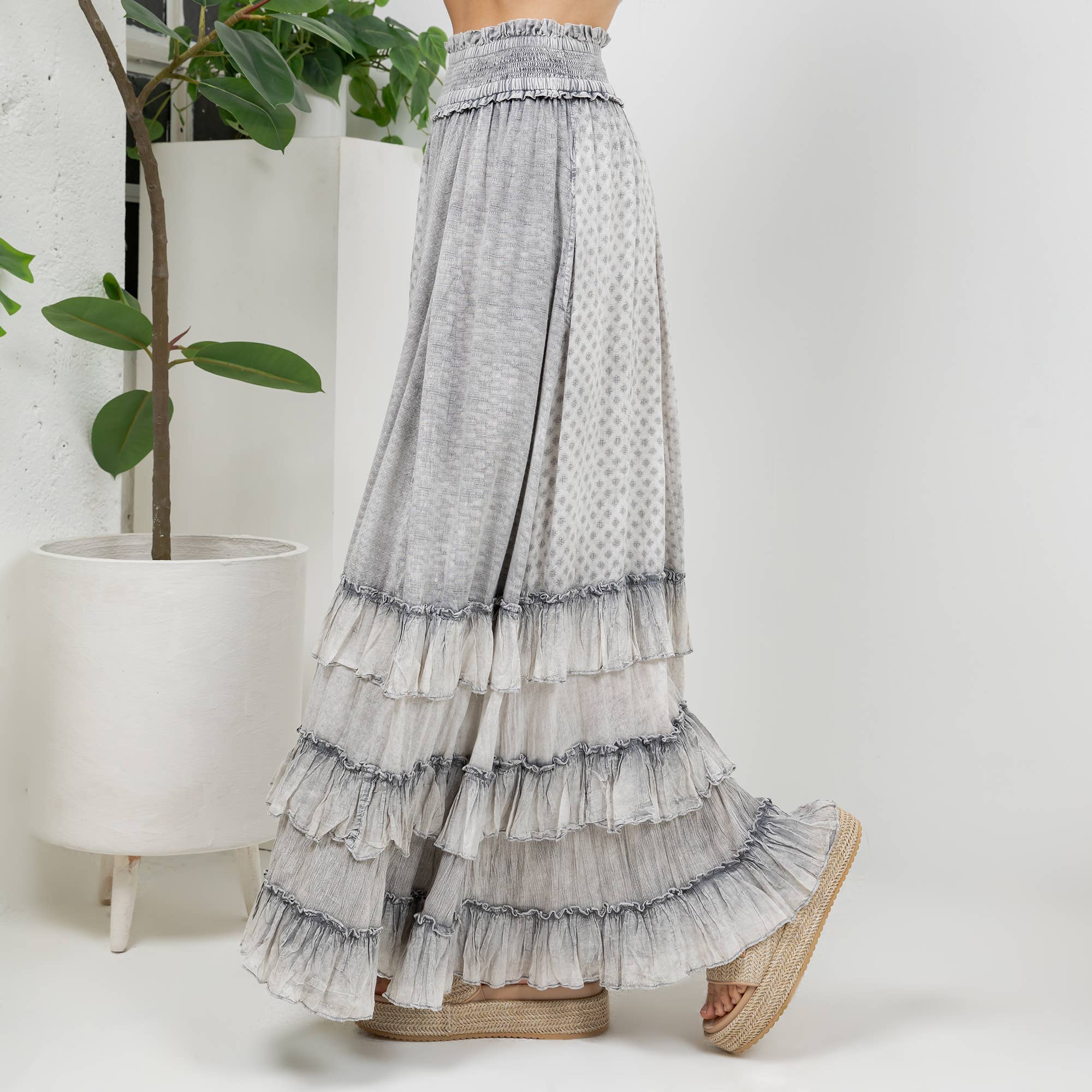 The Reverie Ruffled Tiered Maxi Skirt in Grey - side angle showing graceful movement and textured fabric