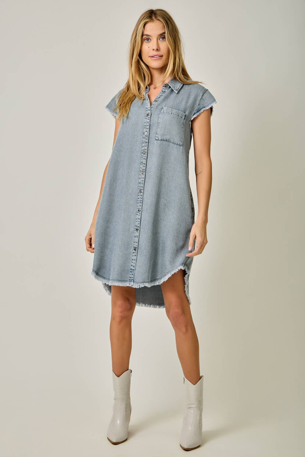 Fringe Hem Tencel Shirt Dress in Light Denim Blue — button-down front, flutter cap sleeves, fringed hi-lo hem, and side pockets

