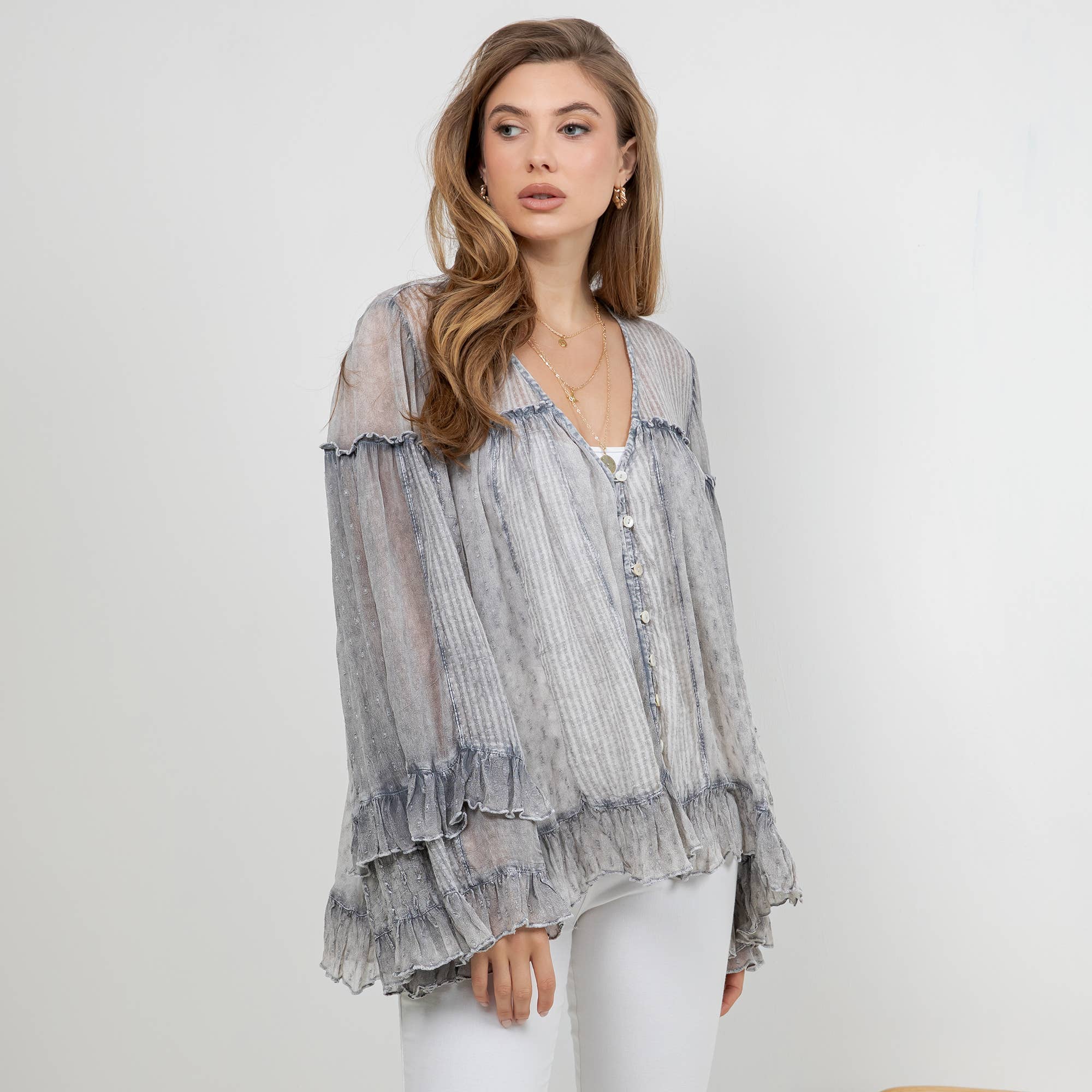 The Reverie Sheer Ruffled Blouse in Grey - full-length view highlighting sheer fabric and long ruffled sleeves