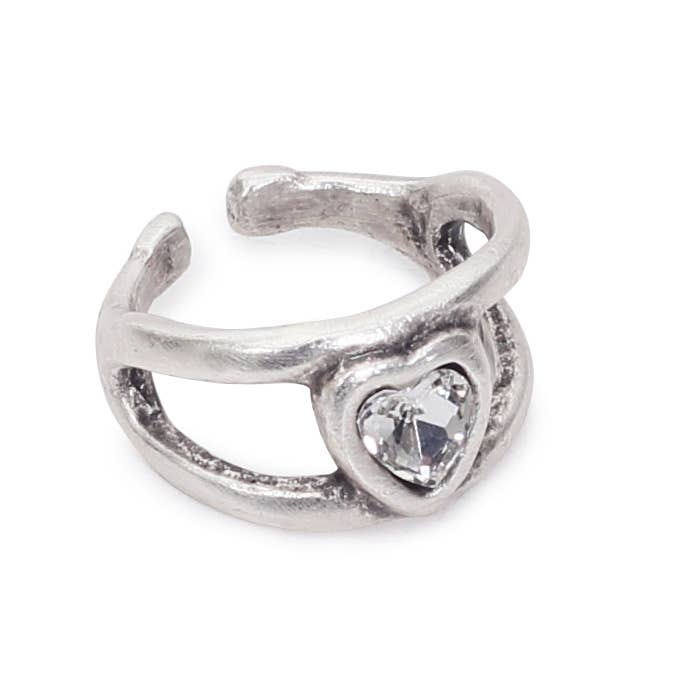 A textured sterling silver open ring band featuring a heart-shaped clear crystal centerpiece, shown on a plain white background.