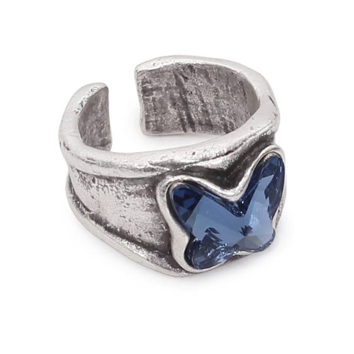 Silver ring with a blue gemstone on a white background