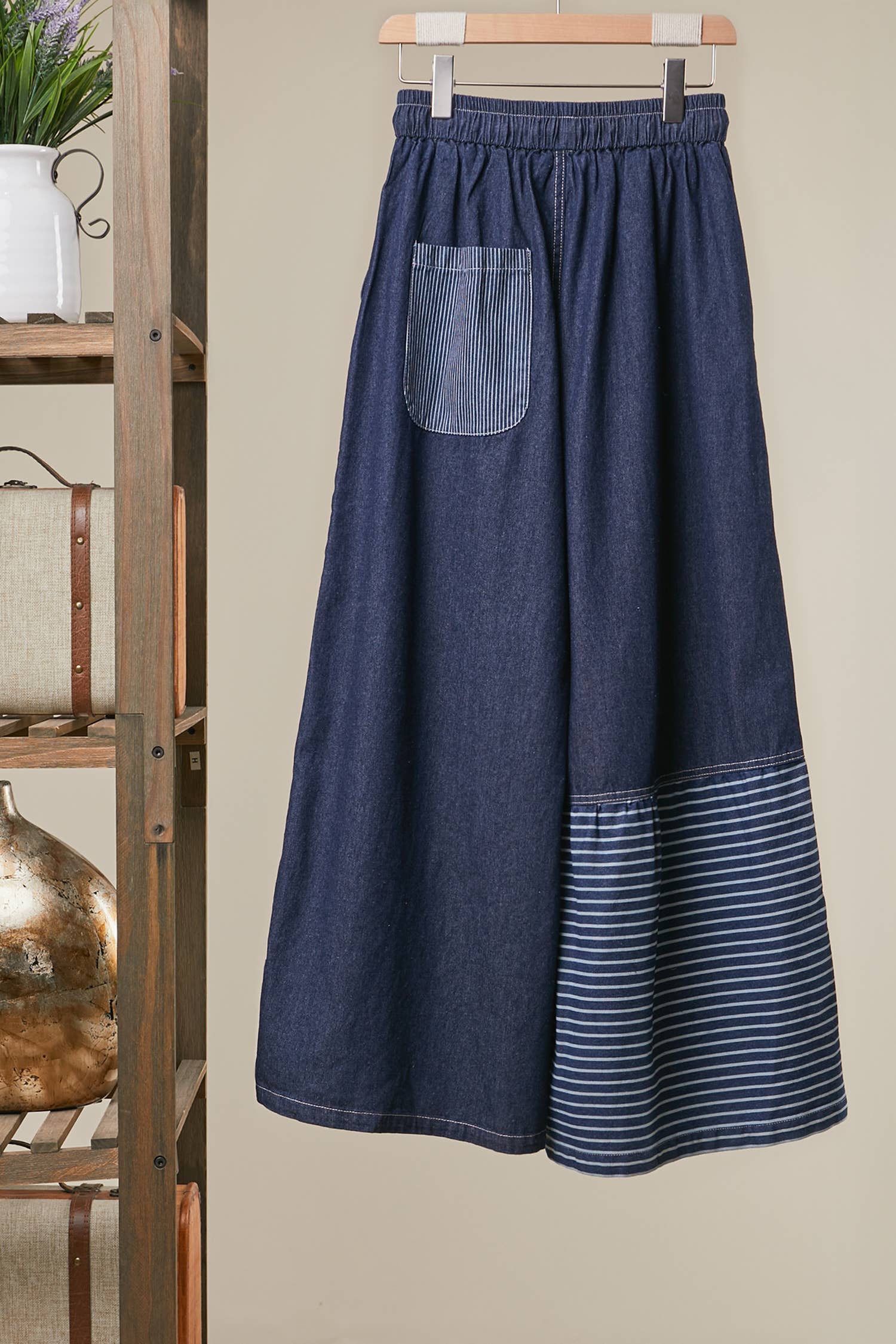 Back view of Blue Star Wide Leg Patchwork Denim Pants in dark blue wash with frayed star patches, elastic waist and drawstring — boho wide leg style by Mello
