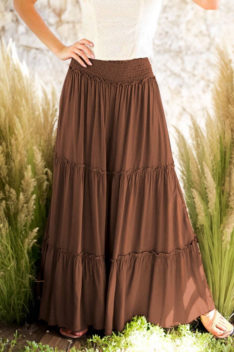 Woman wearing tiered palazzo pants with smocked waistband in mocha l