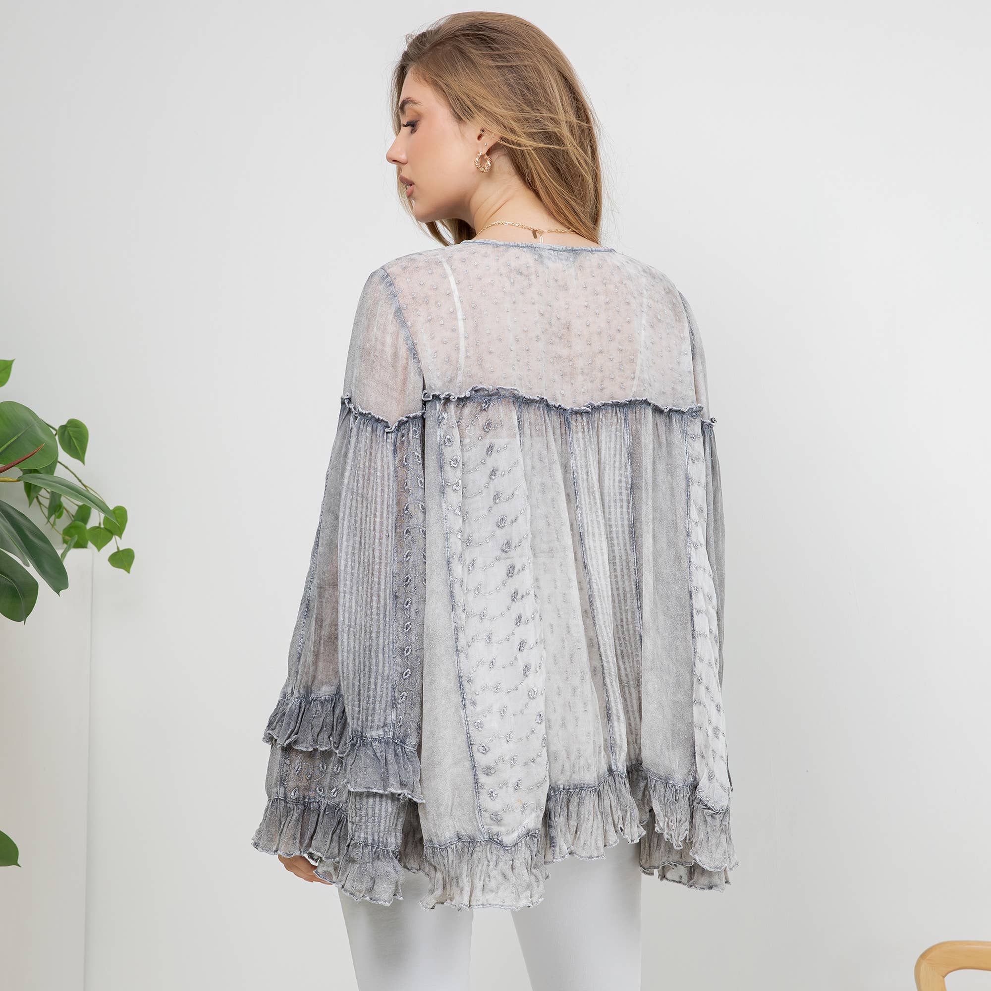 The Reverie Sheer Ruffled Blouse in Grey - back view of sheer cotton-viscose blouse