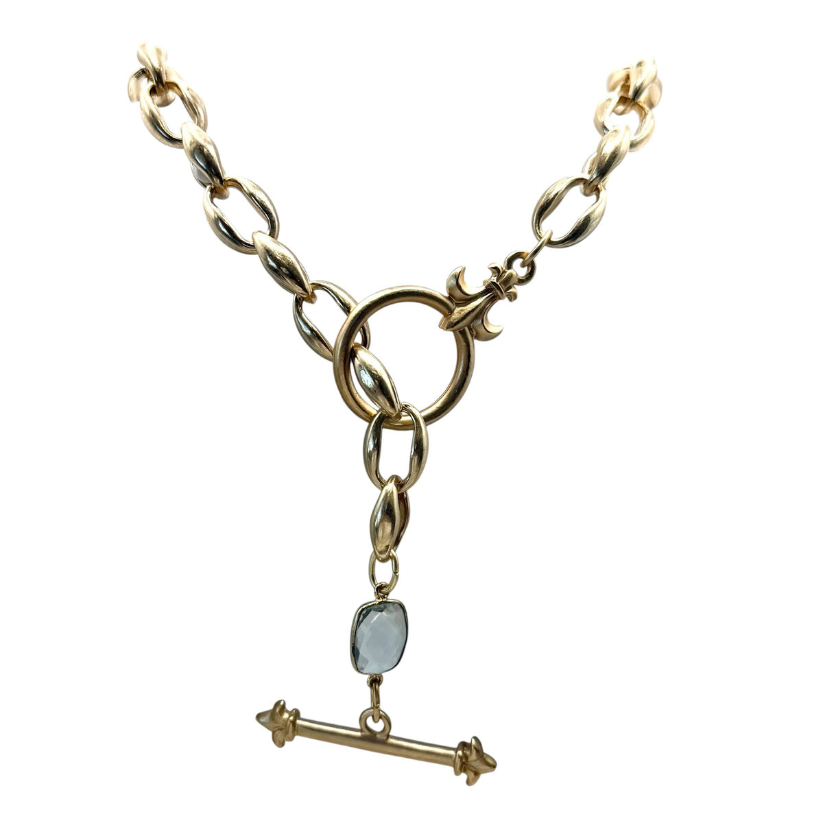 A gold-tone Y-shaped chain necklace with a central ring, a small oval light blue stone, and a horizontal bar toggle clasp, shown on a plain white background.