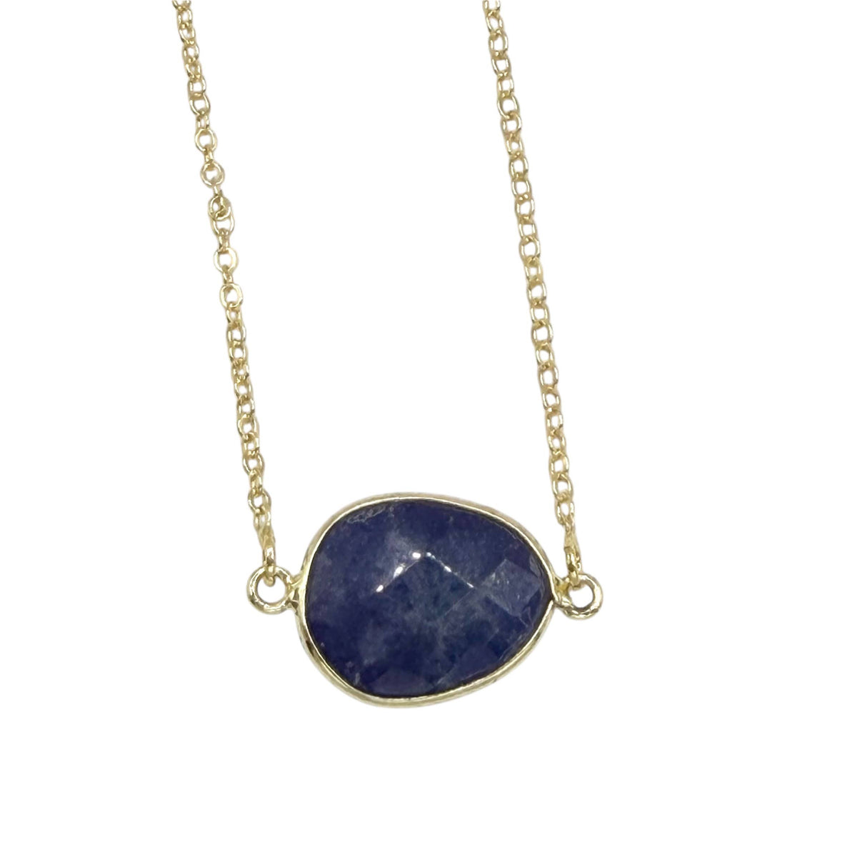 Necklace with a blue stone pendant on a gold chain against a white background