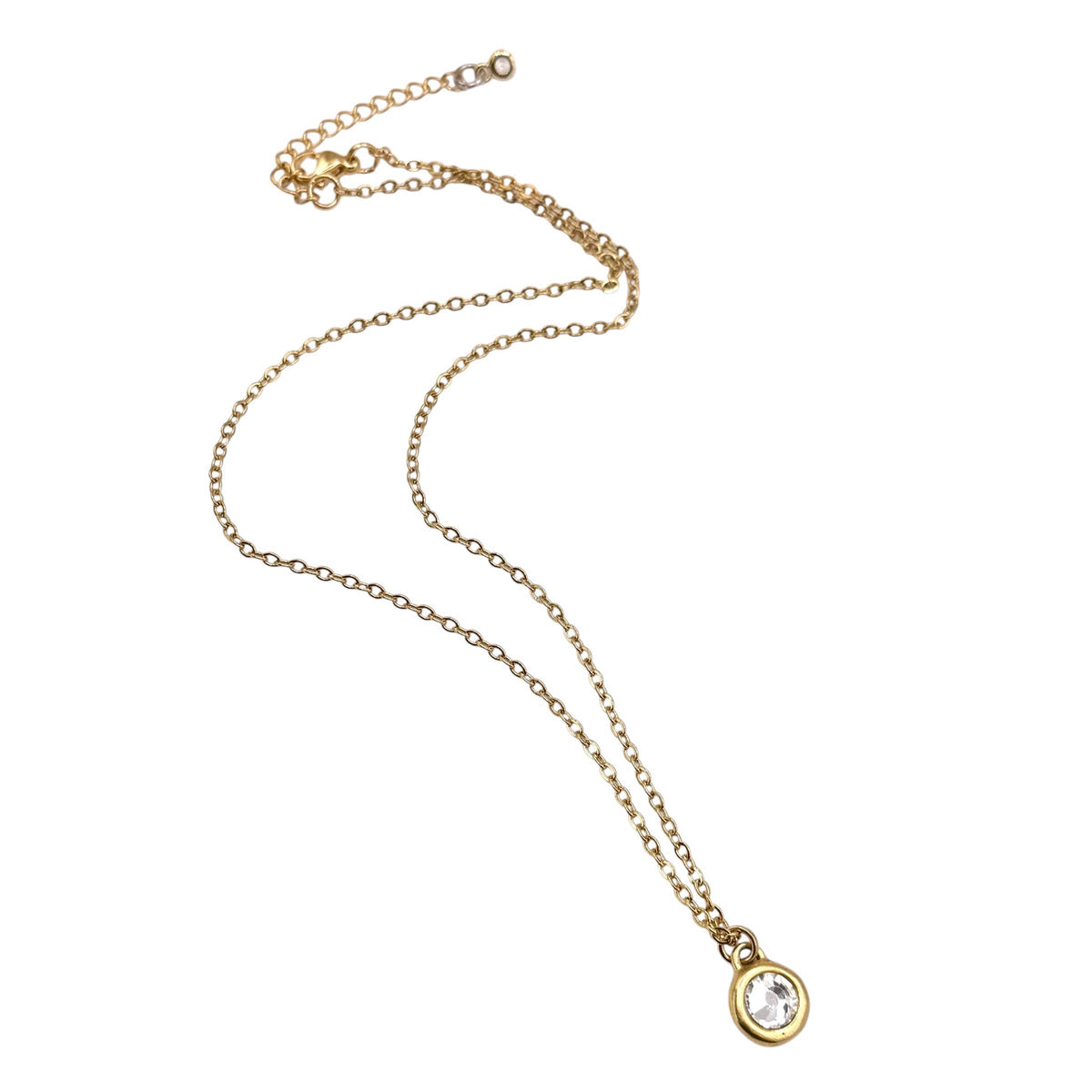 A delicate gold chain necklace with a small oval pendant featuring a clear round gemstone, displayed on a plain white background.