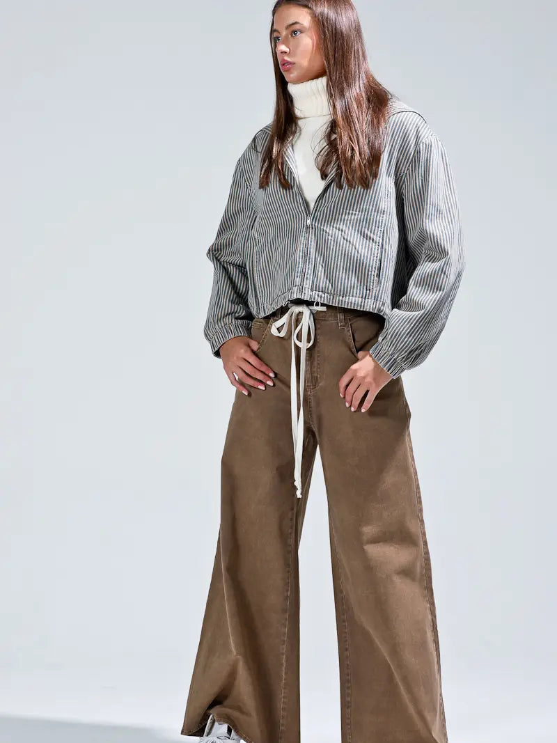 Three-quarter front, zip closure and drawstring hem detail visible